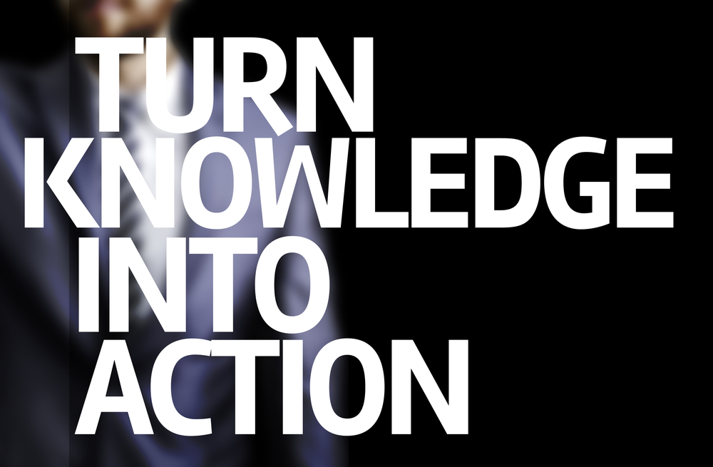 Turn Knowledge Into Action written on a board with a business man on background Turn Knowledge Into Action written on a board with a business man on background